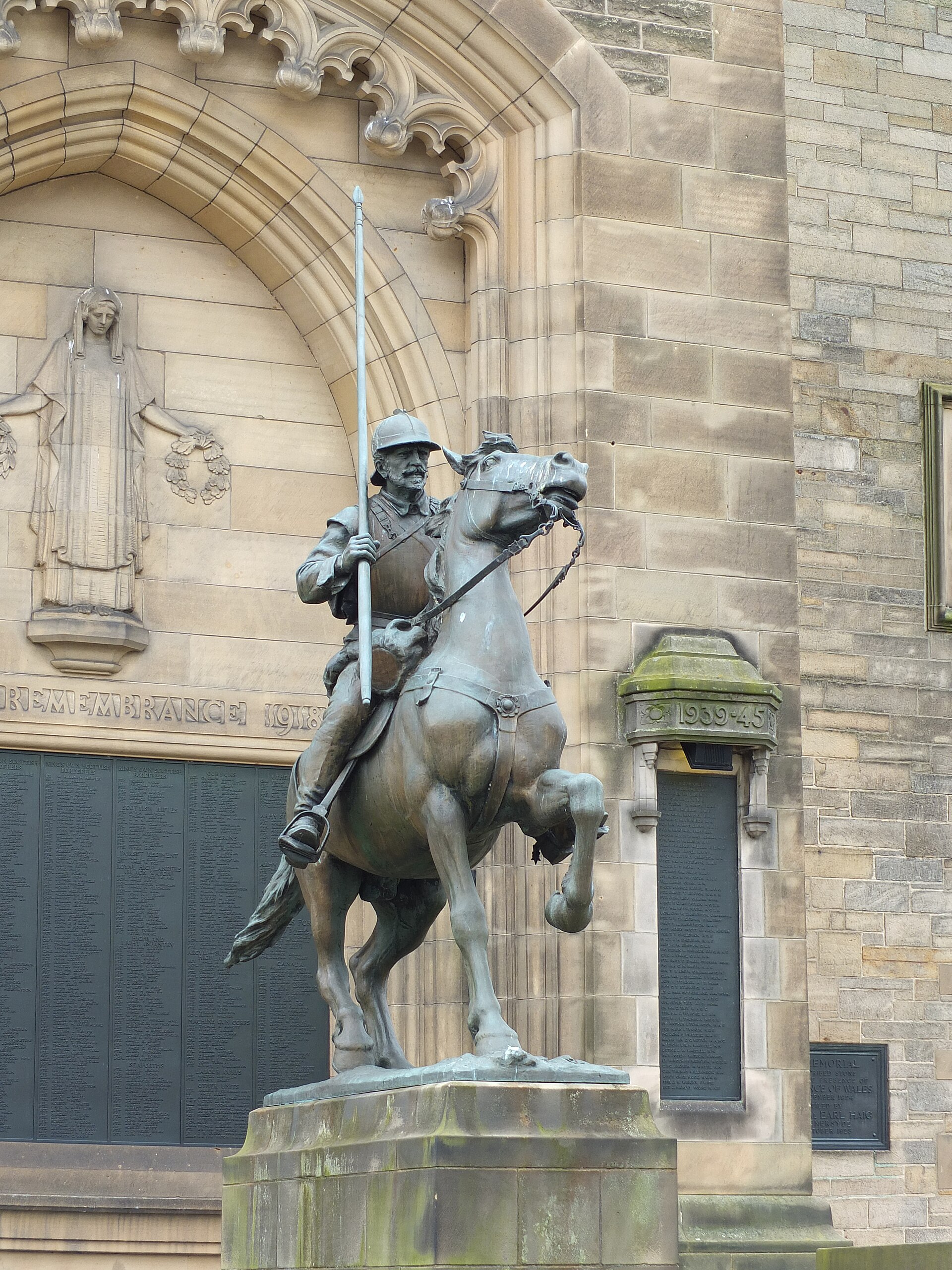 Galashiels War Memorial tower and bronze mounted Border Reiver statue at Cornmill Square
